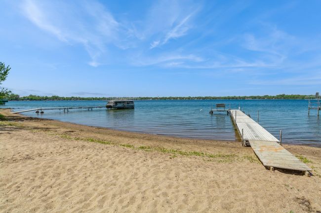 This home has an association maintained beach area that comes with use of the dock and picnic areas. It is located about a half block from this home. The association dues are currently $70 a year. | Image 58