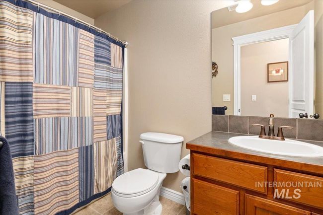 Bathroom featuring vanity, tile patterned flooring, and a shower with shower curtain | Image 20