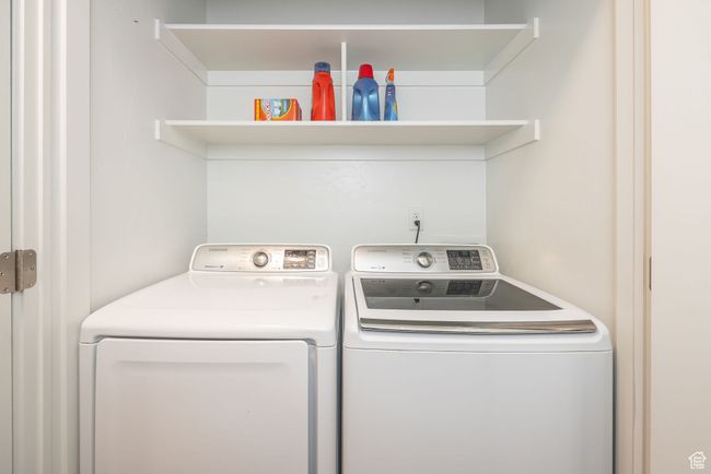 Laundry area with washer and clothes dryer | Image 13