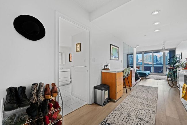 Hallway with floor to ceiling windows, recessed lighting, and light wood-style floors | Image 7