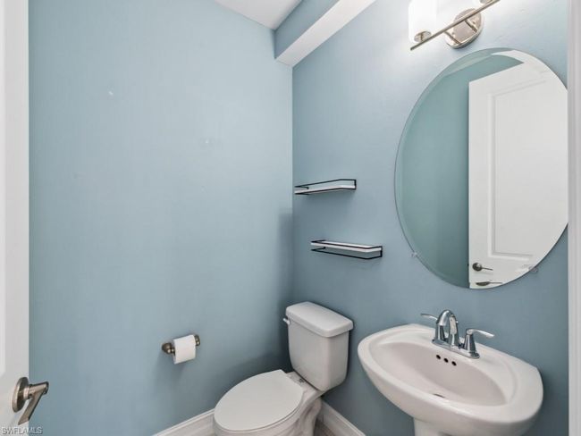Bathroom with sink and toilet | Image 13