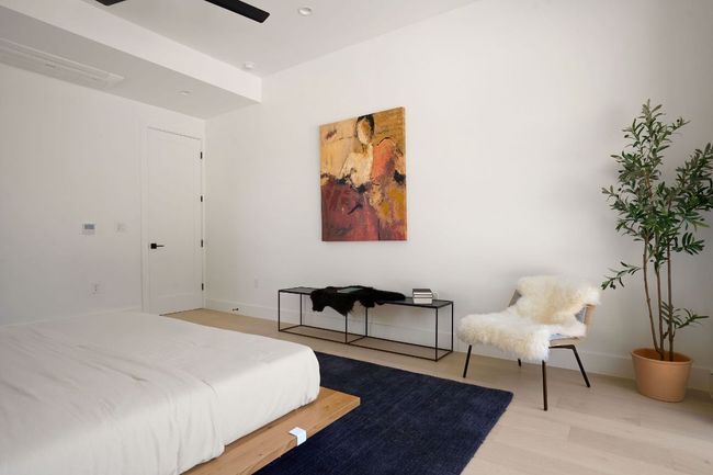Bedroom featuring light wood finished floors and baseboards | Image 38