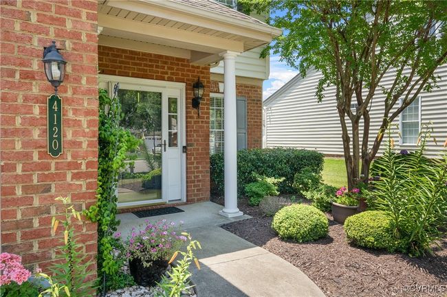 View of exterior entry featuring brick siding | Image 4