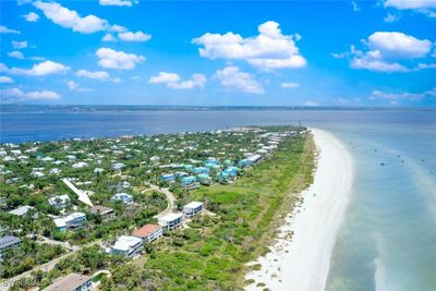 Drone / aerial view featuring beach and Gulf - East End of island towards Lighthouse | Image 3