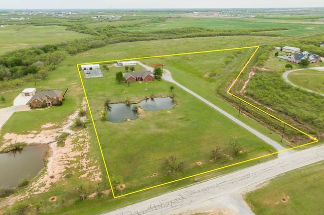 Birds eye view of property featuring a rural view and a water view | Image 34