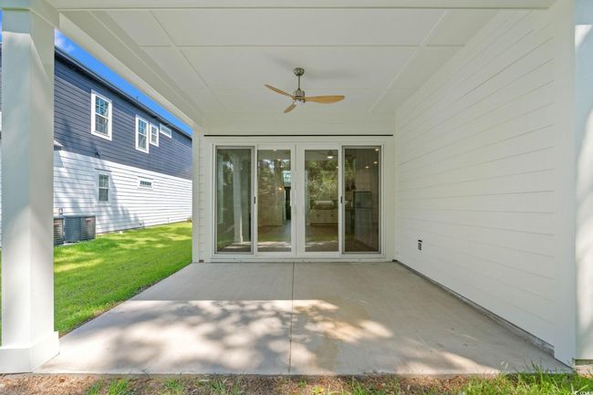 View of patio featuring a ceiling fan | Image 20