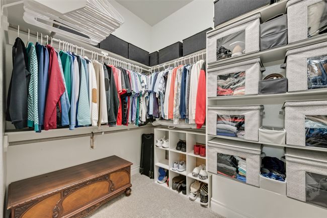 The primary suite offers 2 walk-in closets with custom closet systems! | Image 19