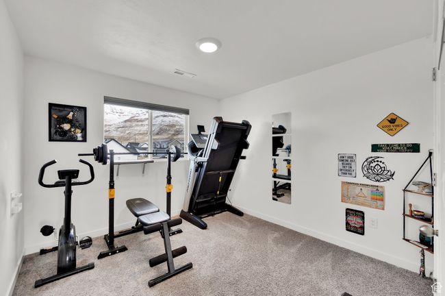 Exercise area with carpet, baseboards, and visible vents | Image 19