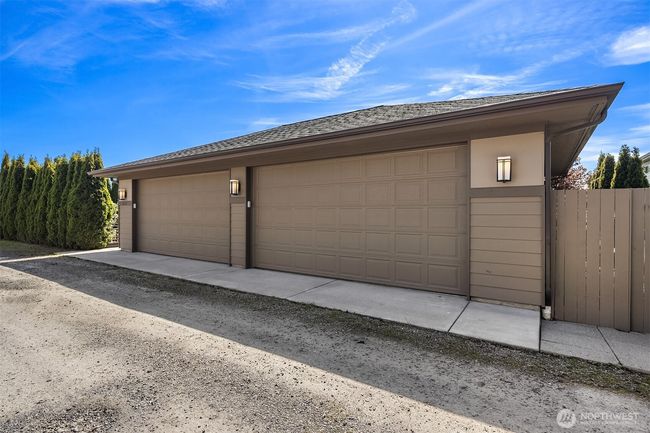 Oversized four car garage with flat alley access. | Image 38