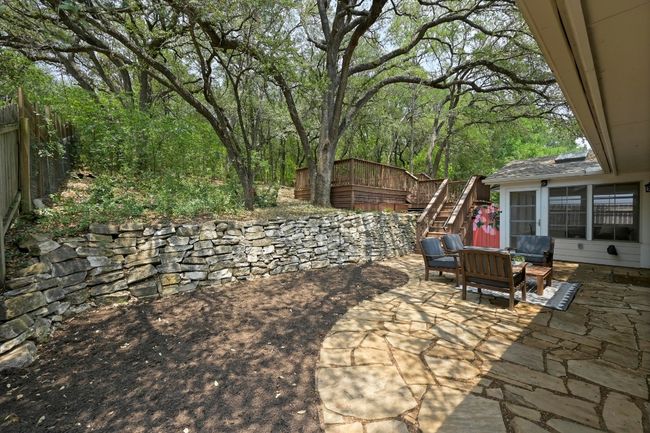 This yard is already enchanting, yet imagine how whimsical it would feel with lights draped from the oaks. | Image 22
