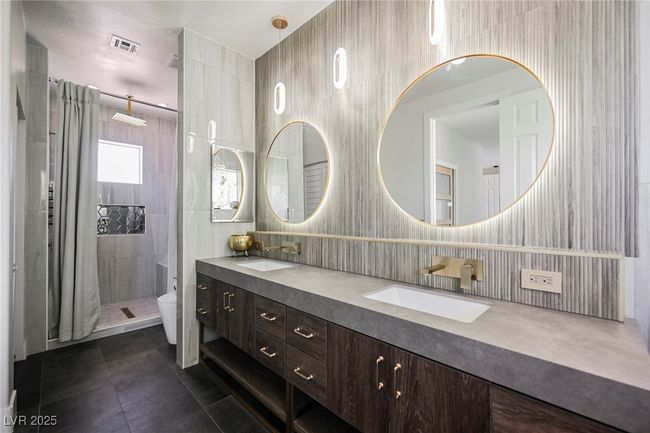 Mater Bathroom featuring a sink, tile walls, and tile patterned flooring | Image 55