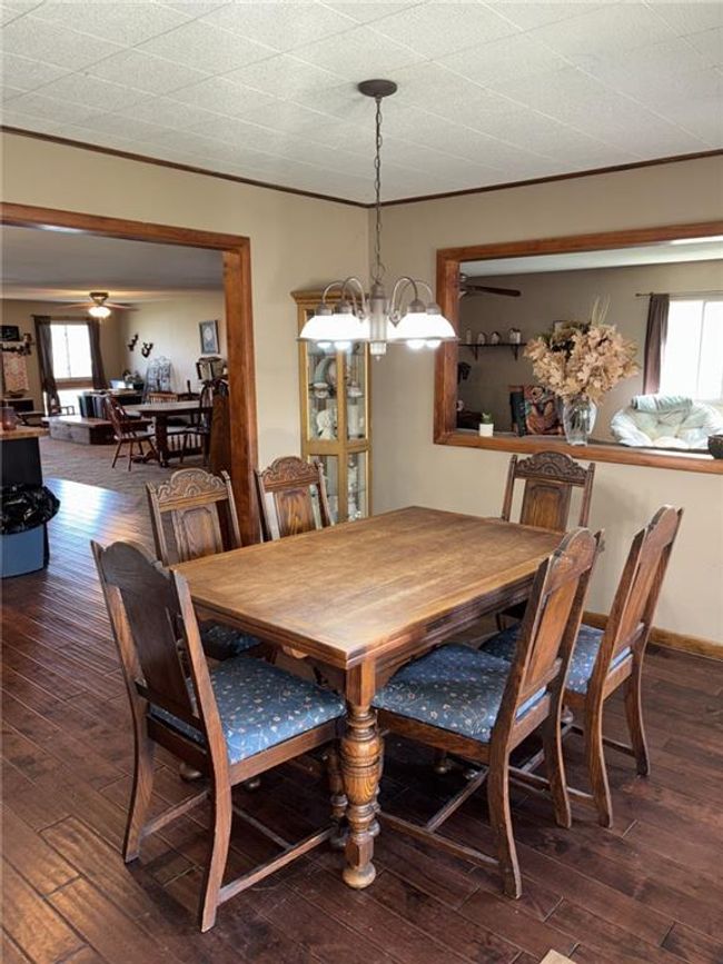 Dining space with a chandelier, hardwood / wood-style floors, and crown molding | Image 8