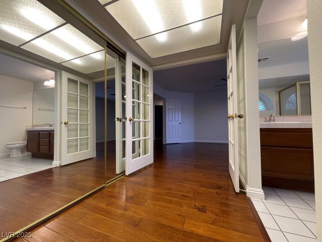Hallway with french doors and hardwood / wood-style floors | Image 27