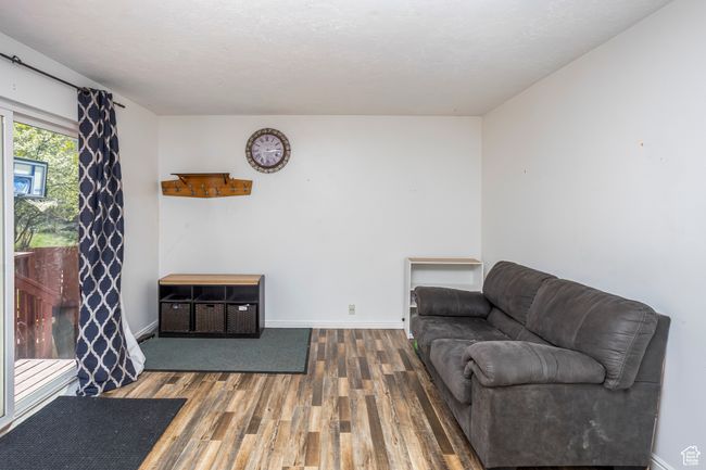 Living area featuring wood finished floors and baseboards | Image 11