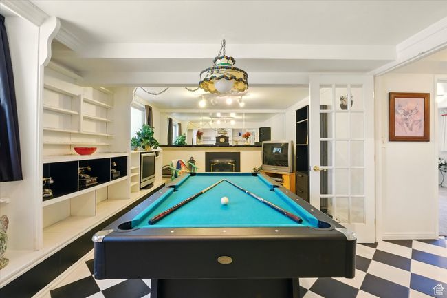 Game room with tile patterned floors and pool table | Image 14