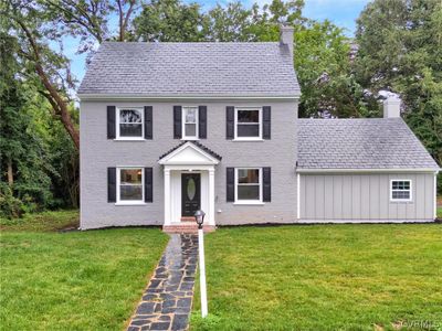 Colonial house featuring a front lawn | Image 1