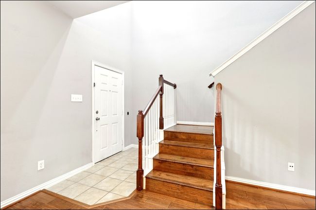Foyer entrance with baseboards, stairway, and light wood-type flooring | Image 4
