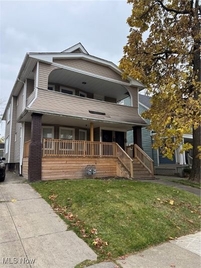 View of front of property with covered porch and a front yard | Image 1