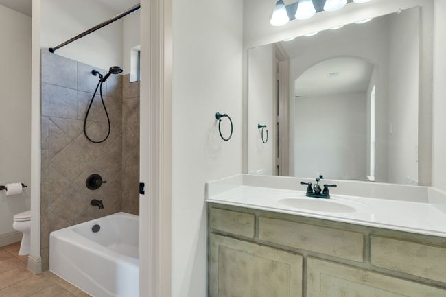 Full bathroom featuring vanity and shower / bath combination | Image 26