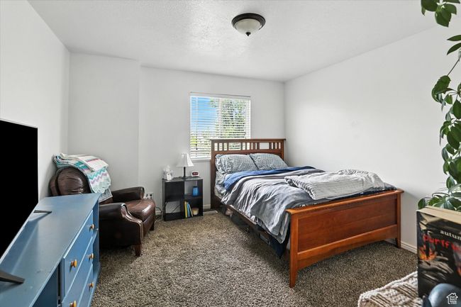 Bedroom with carpet flooring and baseboards | Image 22