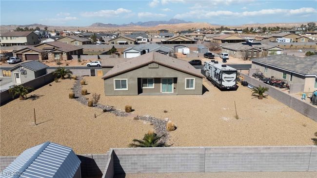 Birds eye view of property featuring a residential view and a mountain view. Some outdoor toys and grill removed virtually. | Image 5