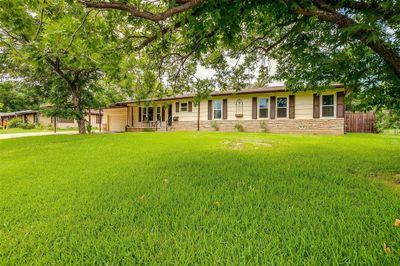 Ranch-style home with a front yard | Image 3