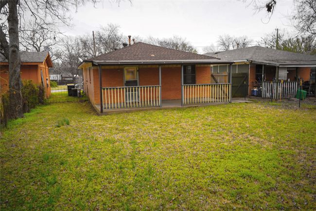 Rear view of house featuring a lawn and fence | Image 23