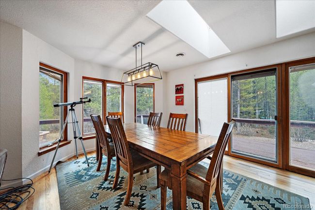 Dining Area with Doors to Wrap Around Deck | Image 15