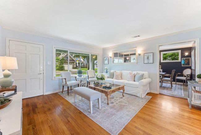 The original, solid white oak hardwood floors add a timeless warmth to this well-proportioned home. | Image 5