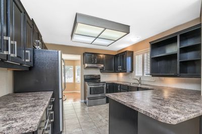 915 Citadel Dr, House other with 4 bedrooms, 2 bathrooms and 4 parking in Port Coquitlam BC | Image 3