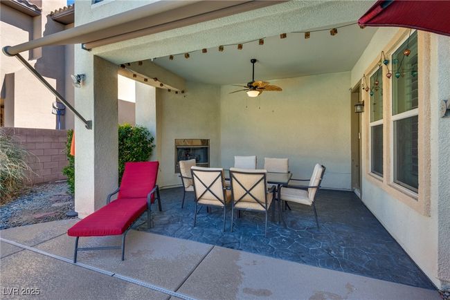View of patio / terrace with outdoor dining area and a ceiling fan | Image 69