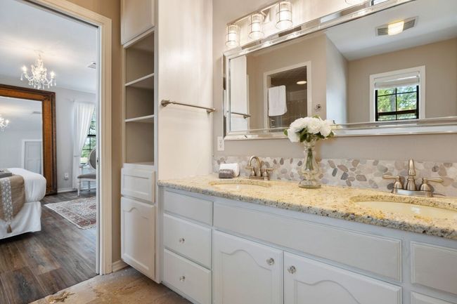 Ensuite bathroom with a chandelier and double vanity | Image 23