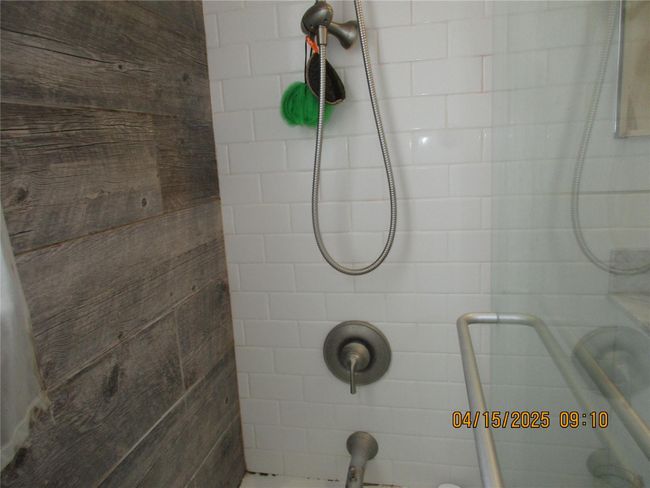 Bathroom featuring tiled shower | Image 16