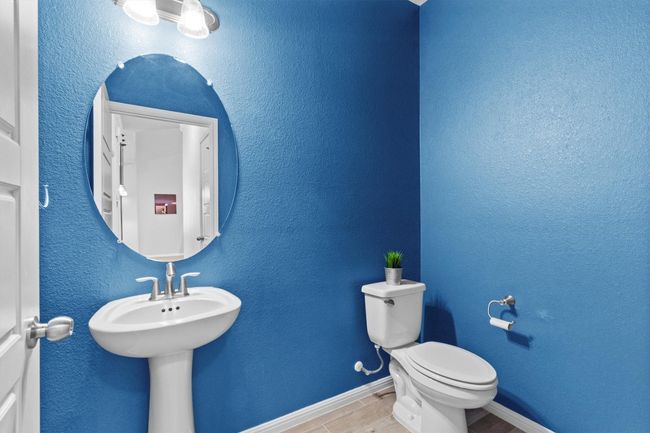 Bathroom featuring toilet and baseboards | Image 30