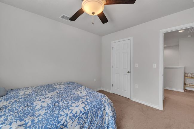 Bedroom featuring carpet, baseboards, and ceiling fan | Image 20