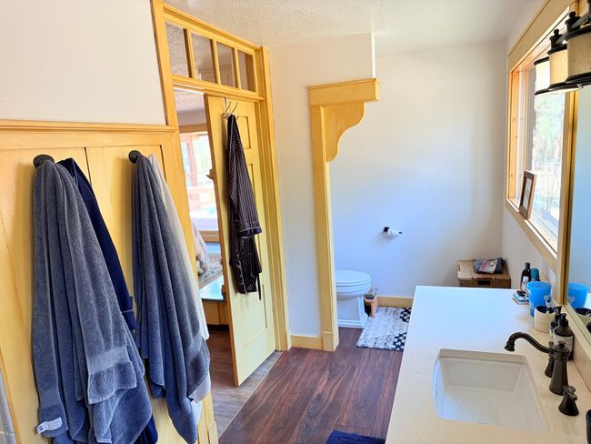 Full bath featuring toilet, wood finished floors, vanity, and a textured ceiling | Image 41