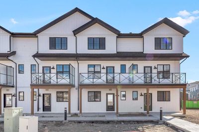 102 - 340 Ambleton St Nw, Home with 4 bedrooms, 2 bathrooms and 3 parking in Calgary AB | Image 1