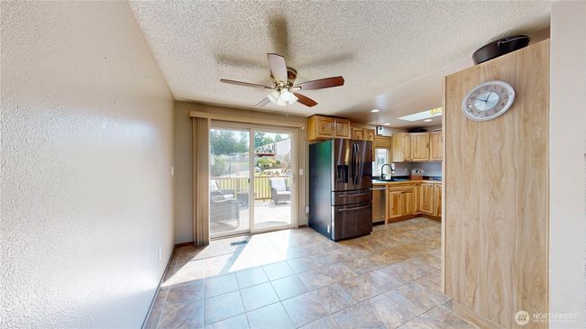 Kitchen eating nook that opens to an entertainment-sized deck | Image 4