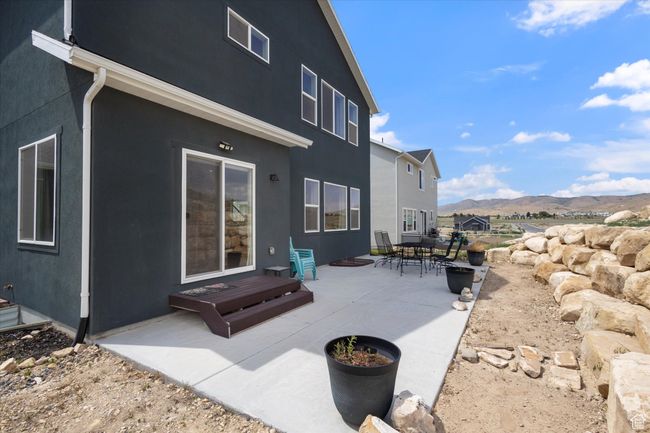 Back of house featuring a mountain view, a patio area, and stucco siding | Image 28