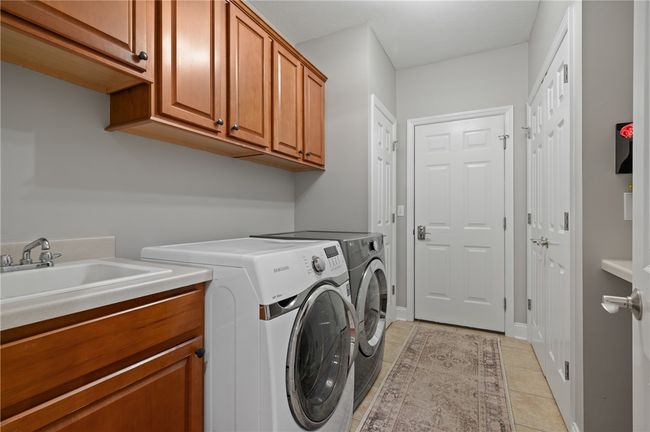 First floor laundry off of attached garage | Image 15