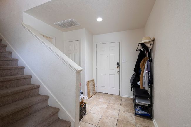 Foyer entrance featuring stairs, recessed lighting, and light tile patterned floors | Image 5
