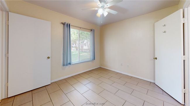 Empty room featuring ceiling fan | Image 25