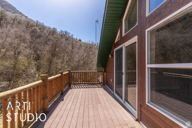 Wooden deck featuring a mountain view | Image 40
