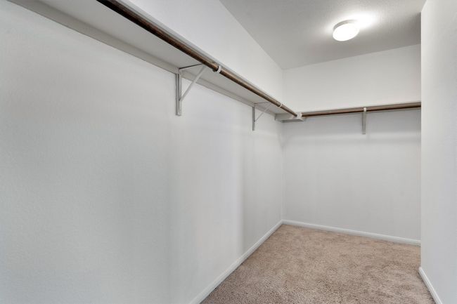 Spacious closet with carpet flooring | Image 18