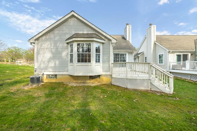 Primary bedroom bay window in rear - pretty view. | Image 26