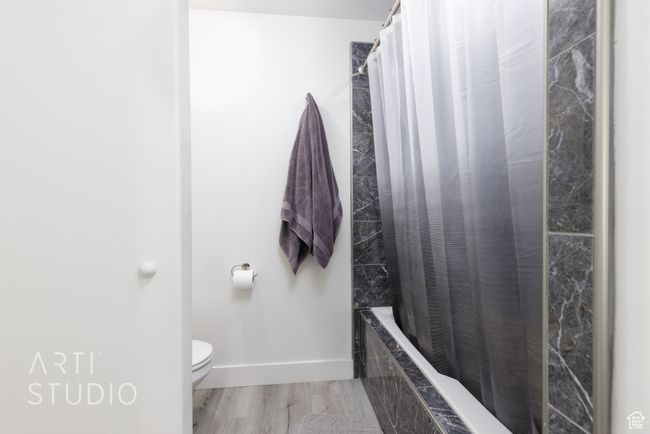 Bathroom featuring baseboards and toilet | Image 20