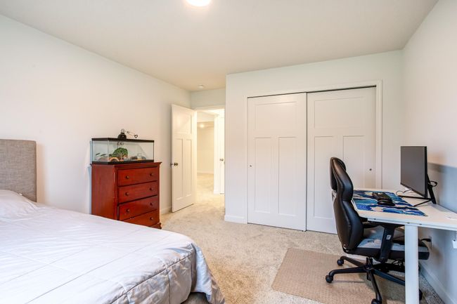 Well-sized room with double-door closet and tranquil views. | Image 38