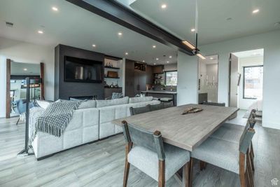 Dining area with light hardwood / wood-style flooring and a fireplace | Image 3