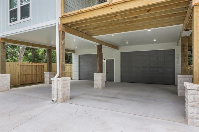 Porte cochere with Austin Limestone wrapped columns and LED lighting big enough to cover 2 vehicles | Image 32