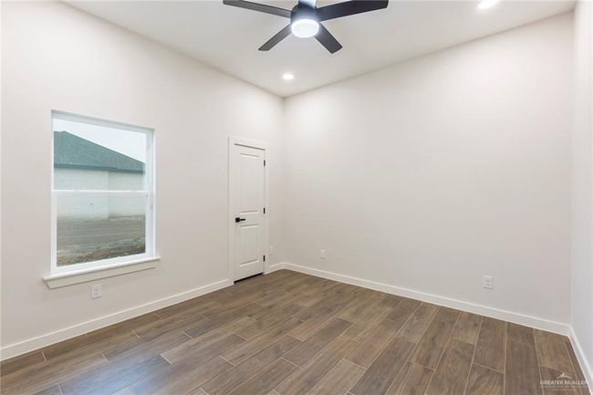 Spare room with ceiling fan | Image 18